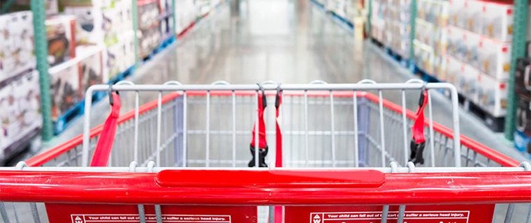 Shopping cart in an aisle of a warehouse club