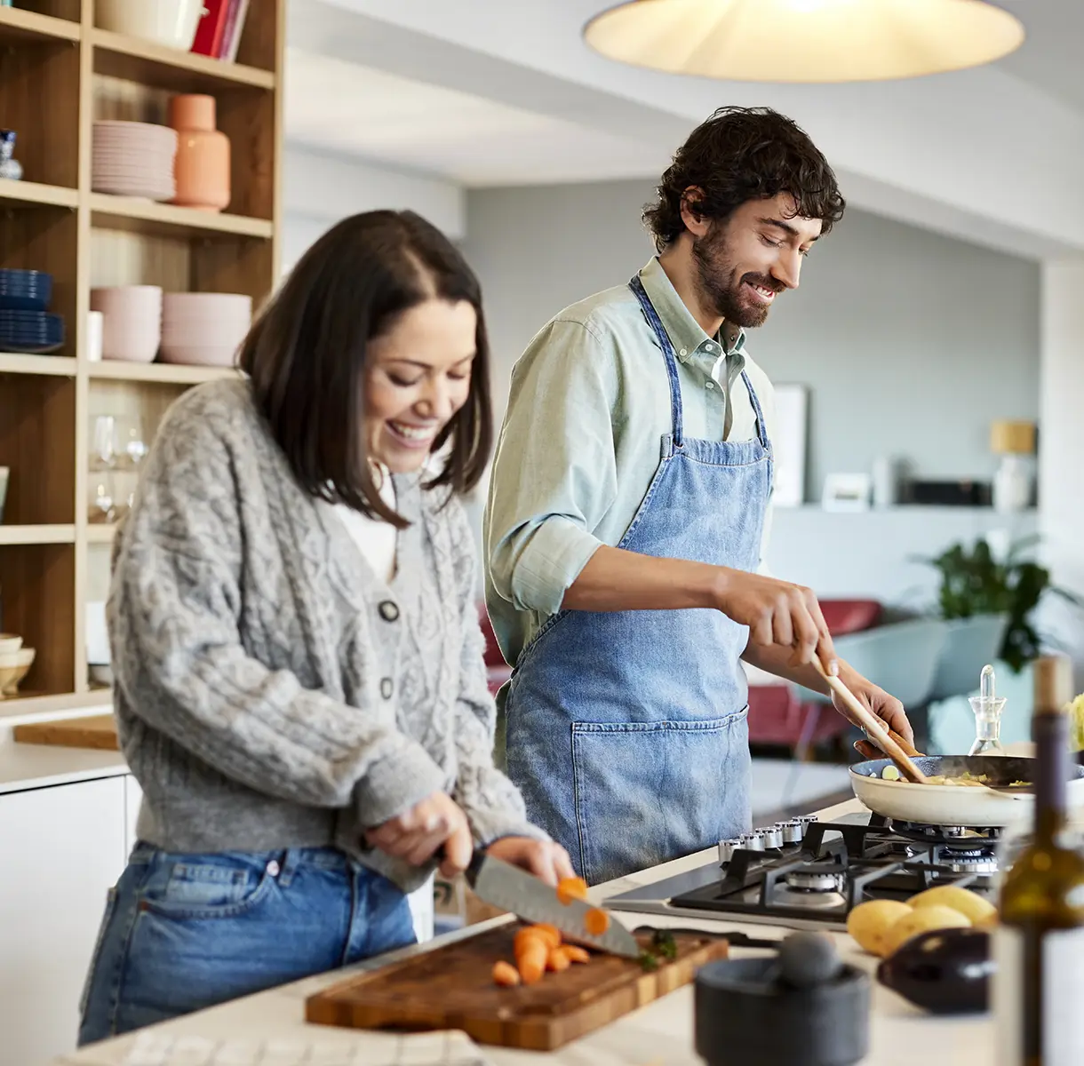 Couple in kitchen cooking together