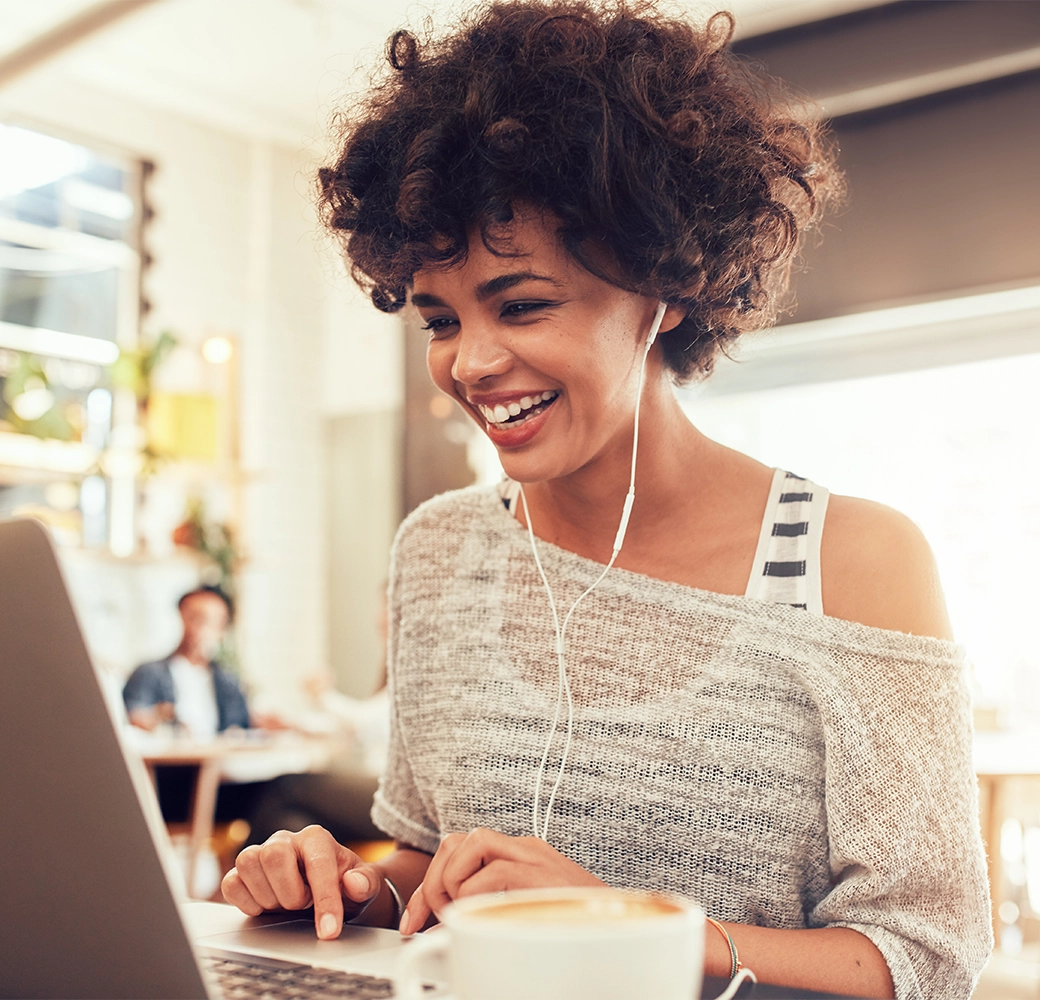 Woman smiling while on her laptop