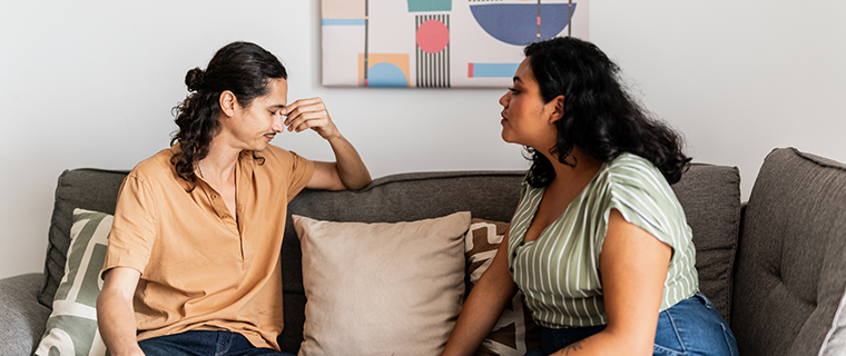 Couple arguing on the couch