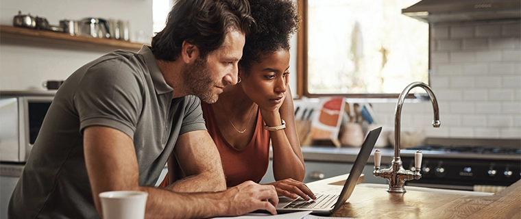 Couple looking at laptop